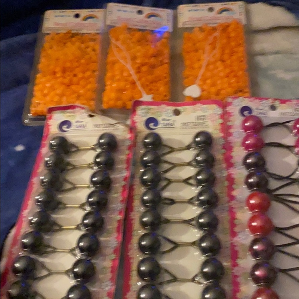 Packs of orange beads and hair balls